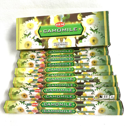 Box of HEM Camomile incense sticks with multiple boxes stacked below on a white background