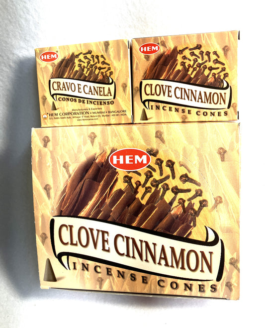 Master carton and two boxes of HEM Clove Cinnamon incense cones shown on a white background