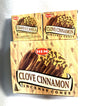 Master carton and two boxes of HEM Clove Cinnamon incense cones shown on a white background