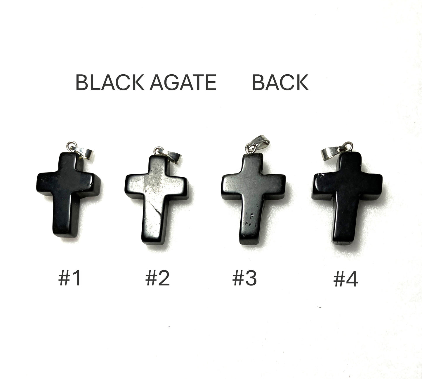 Back of four black agate cross pendants labeled #1 to #4 on a white background.