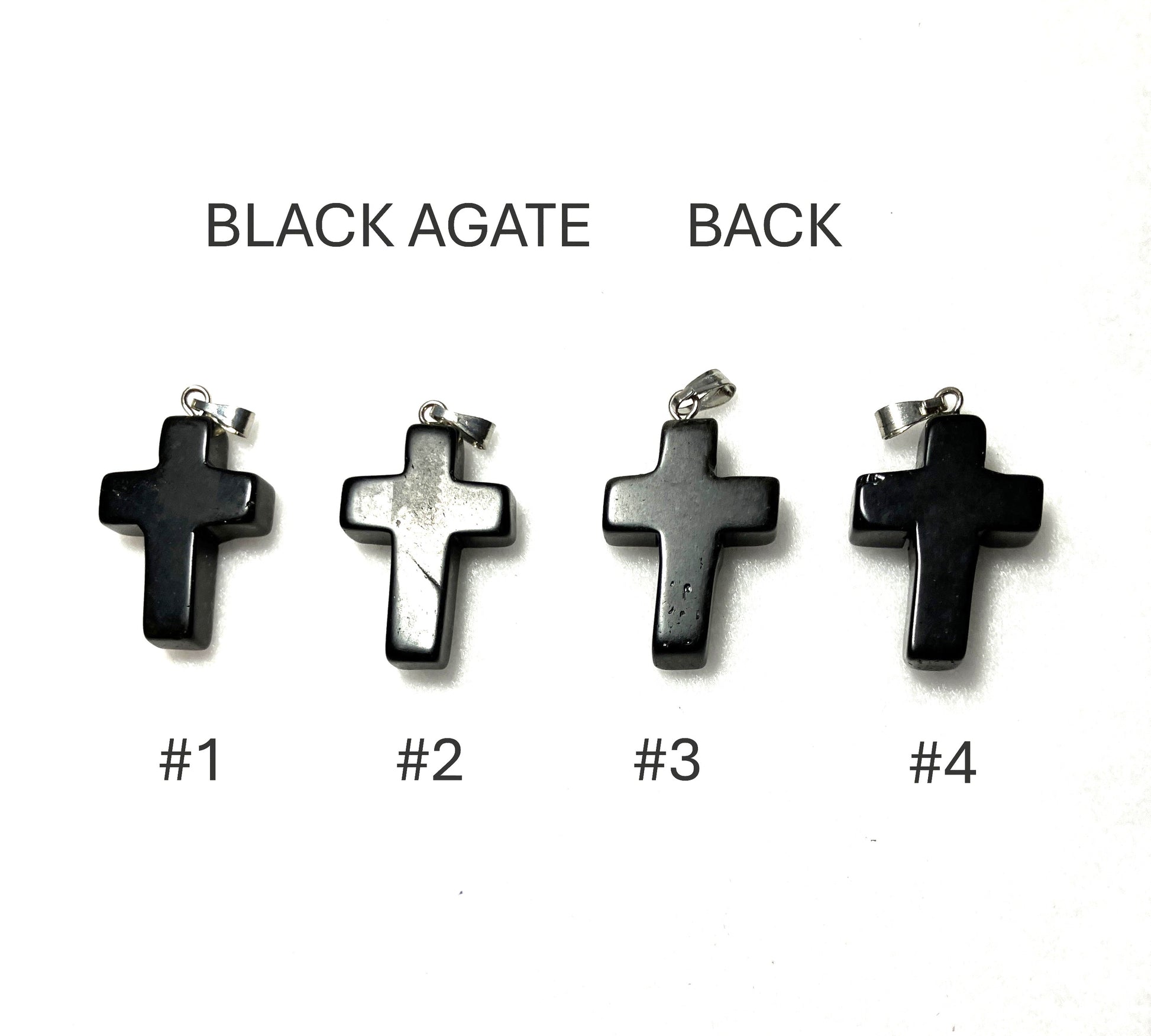 Back of four black agate cross pendants labeled #1 to #4 on a white background.
