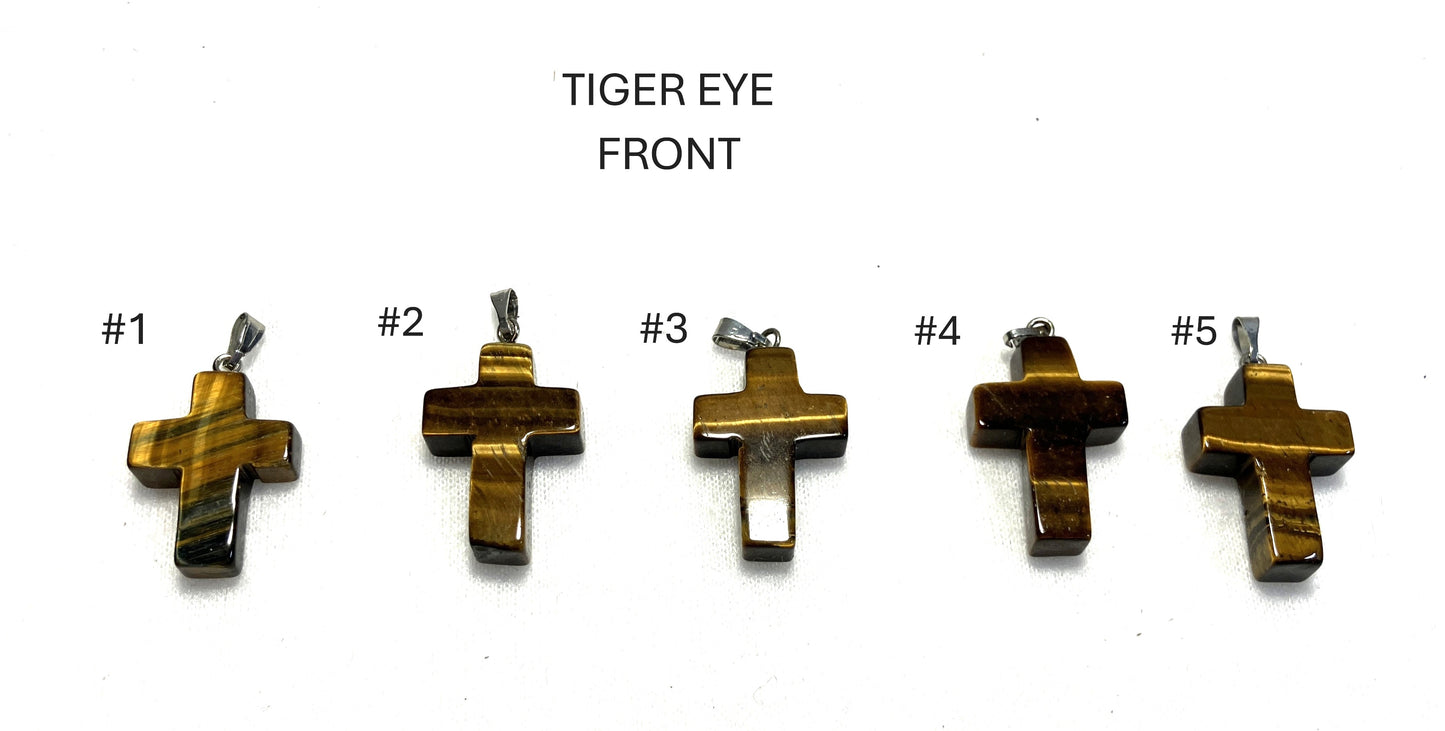 Five Tiger Eye Gemstone Cross pendants shown on a white background