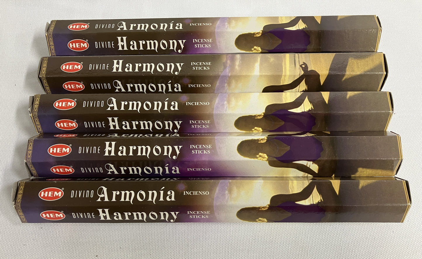 Stack of HEM Armonóa Harmony incense sticks packaging on a white background