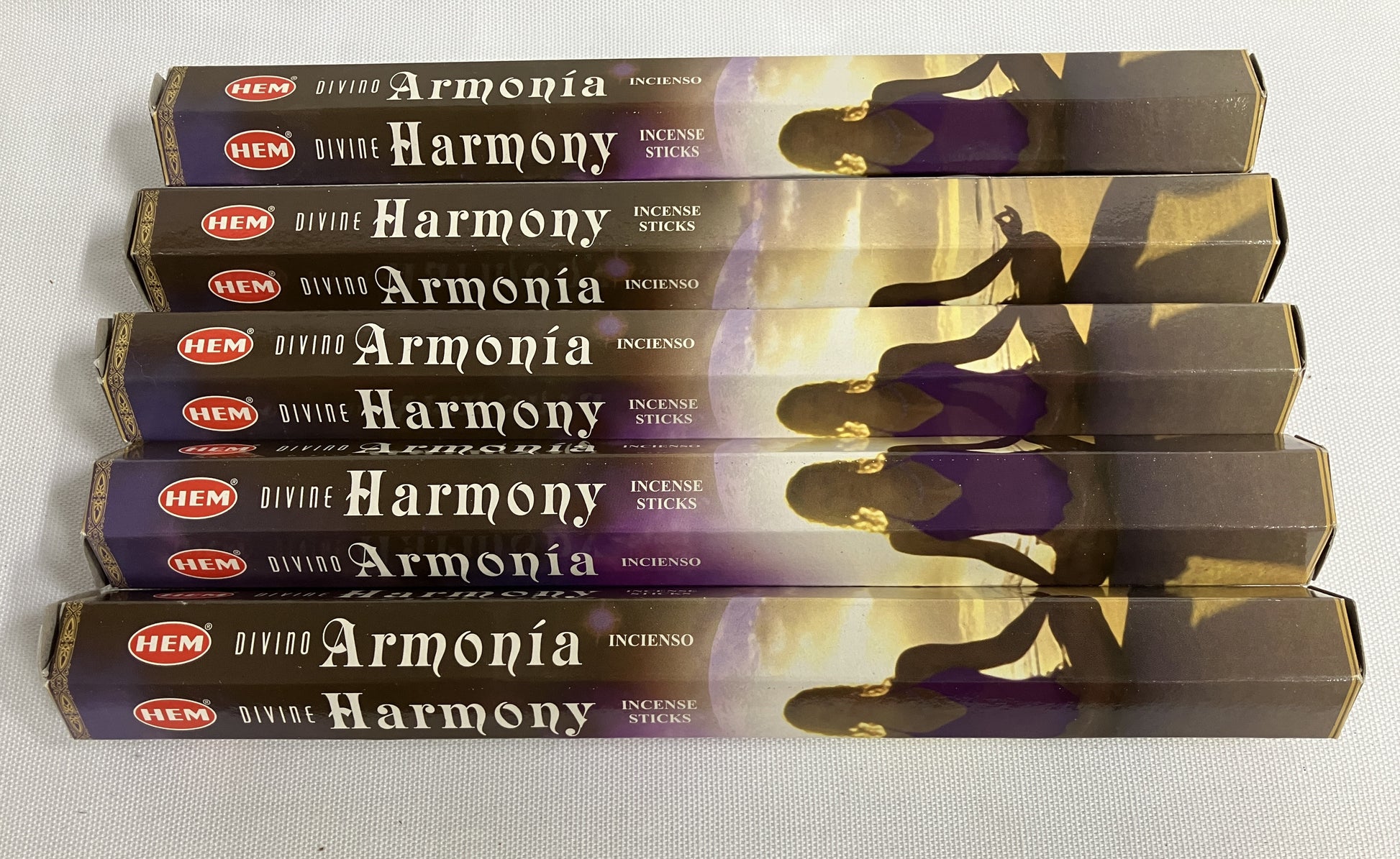 Stack of HEM Armonóa Harmony incense sticks packaging on a white background