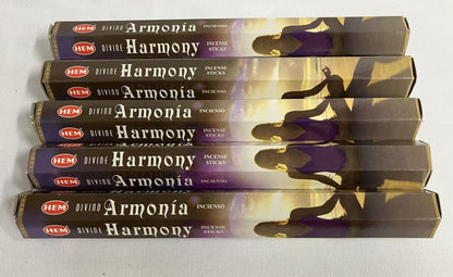 Stack of HEM Armonóa Harmony incense sticks packaging on a white background