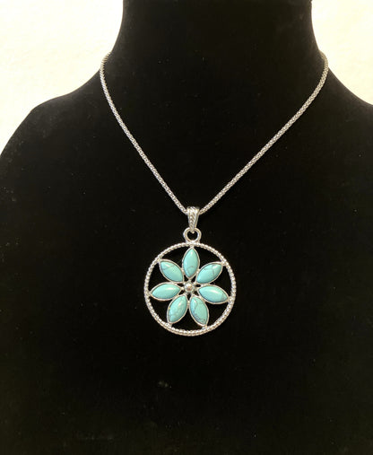 Necklace with a dyed howlite flower pendant on a black mannequin
