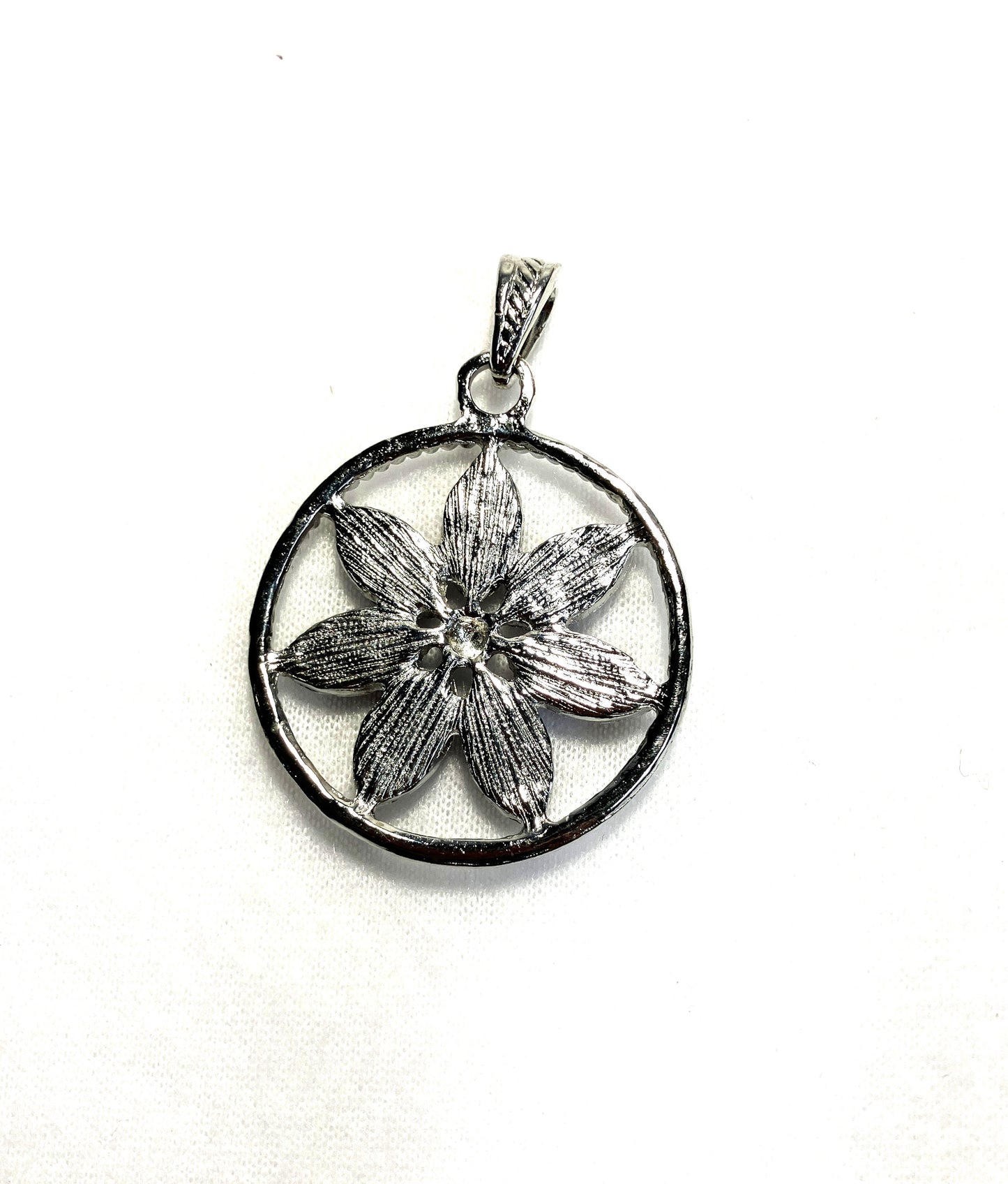 Back side of the flower necklaces with floral design shown on a white background