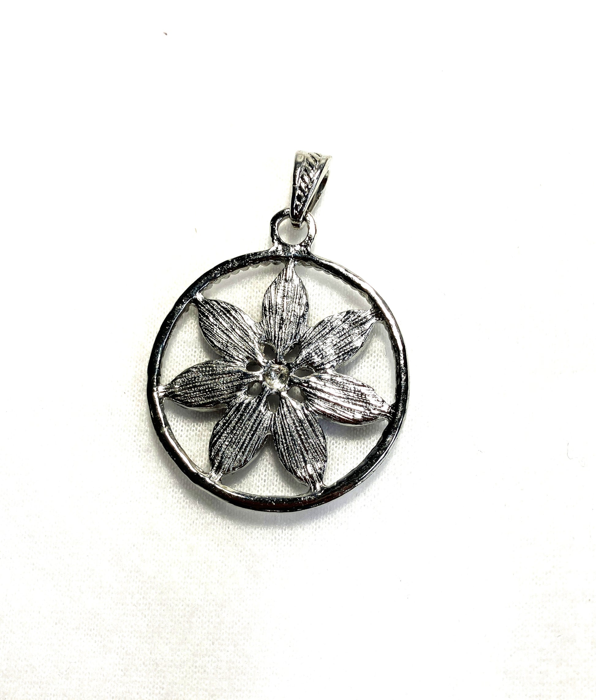 Back side of the flower necklaces with floral design shown on a white background