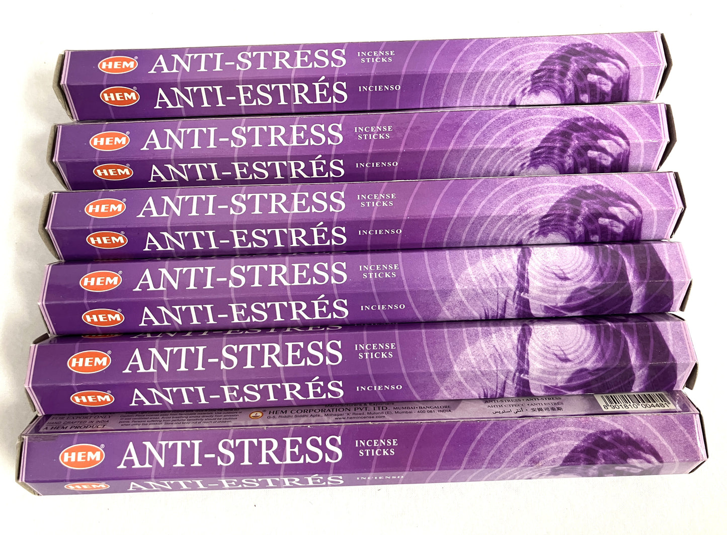Stack of HEM Anti-Stress incense sticks packaging on a white background