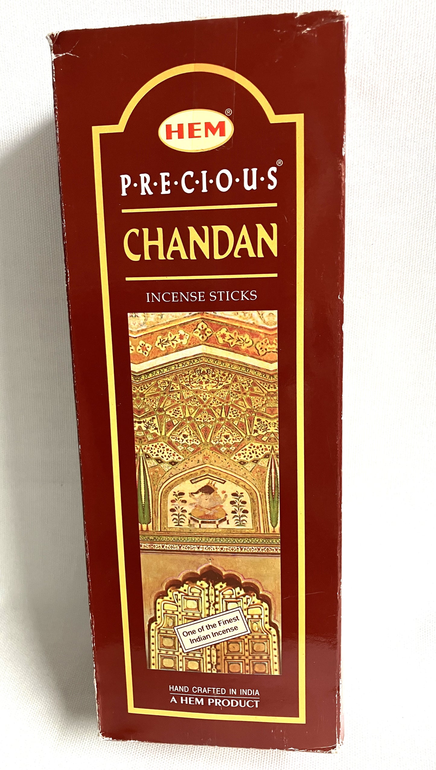 Box of HEM Precious Chandan incense sticks with decorative design on a white background