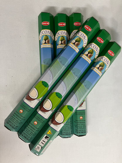 Stack of green HEMA coconut  incense packaging on a white background