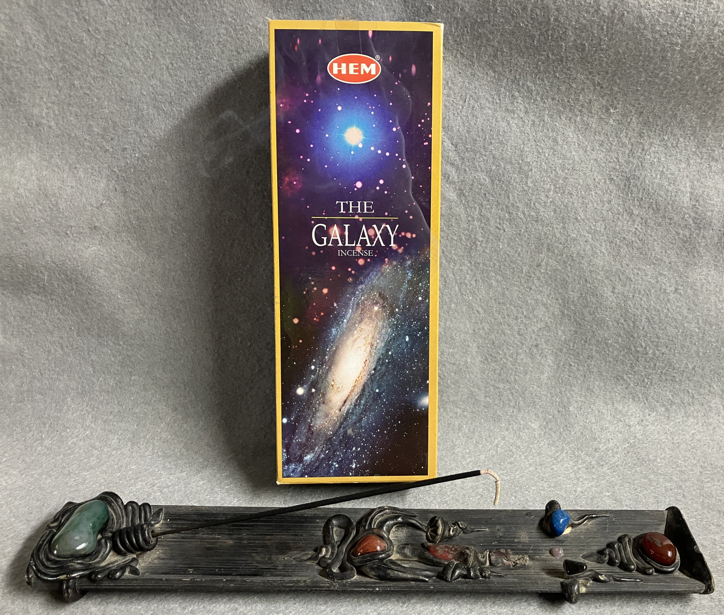 Hem  'The Galaxy' incense box shown with an incense burner on a gray background
