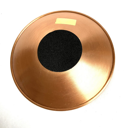 Copper Flower of life bowl showing the bottom with a black fabric center  and label