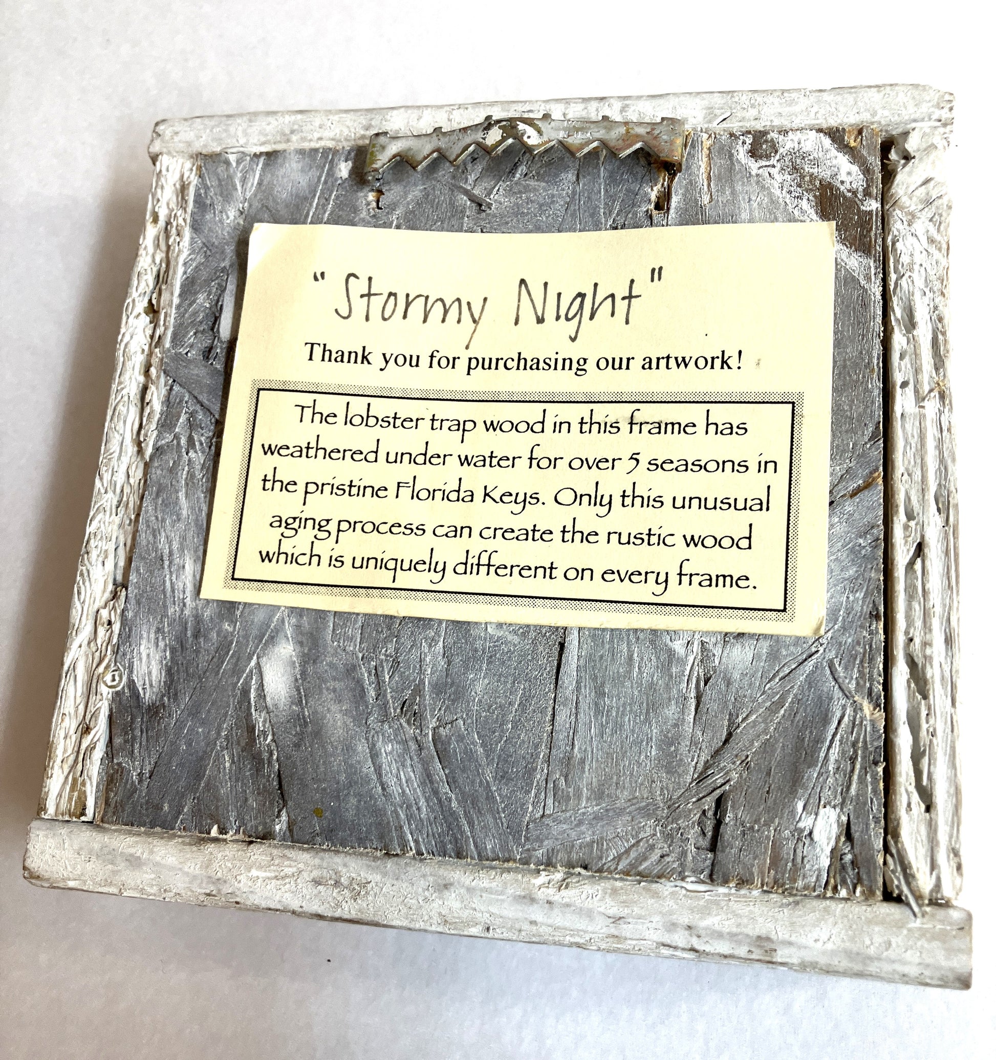 Wooden frame with 'Stormy Night' label depicting the origin of the frame on a white background
