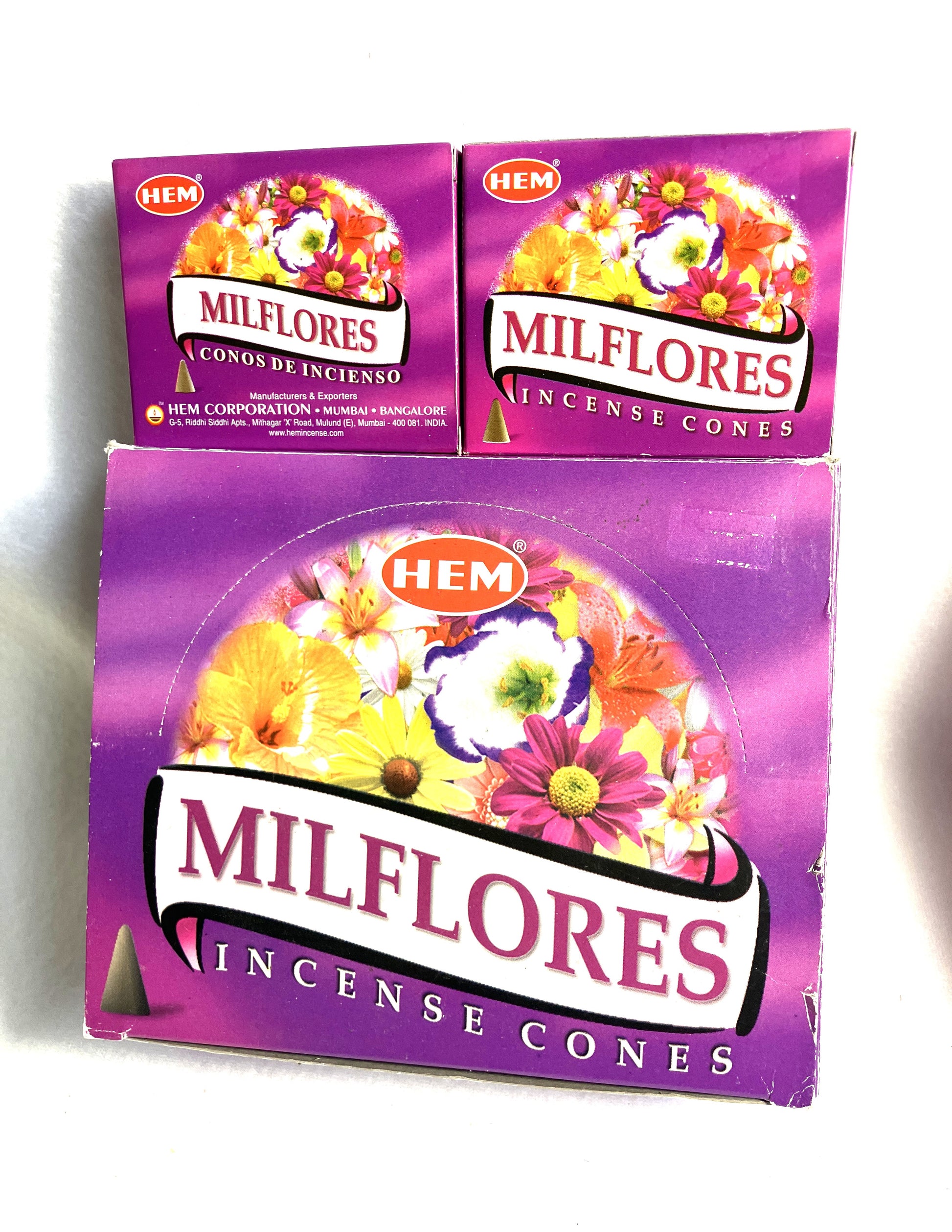 Master carton and two boxes of HEM Milflores Incense Cones shown on a white background