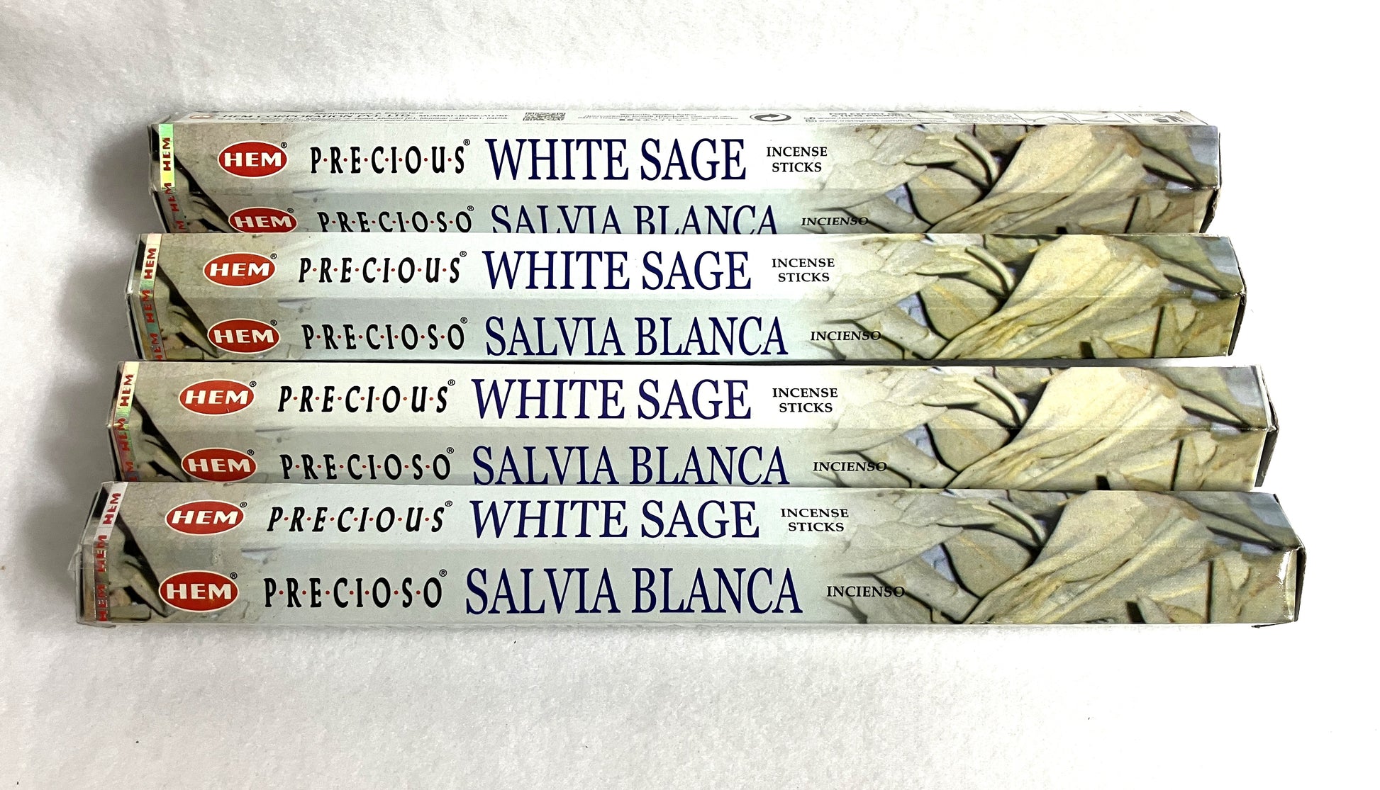 Four packages of HEM Precious White Sage Incense Sticks on a white background