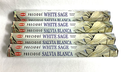 Four packages of HEM Precious White Sage Incense Sticks on a white background