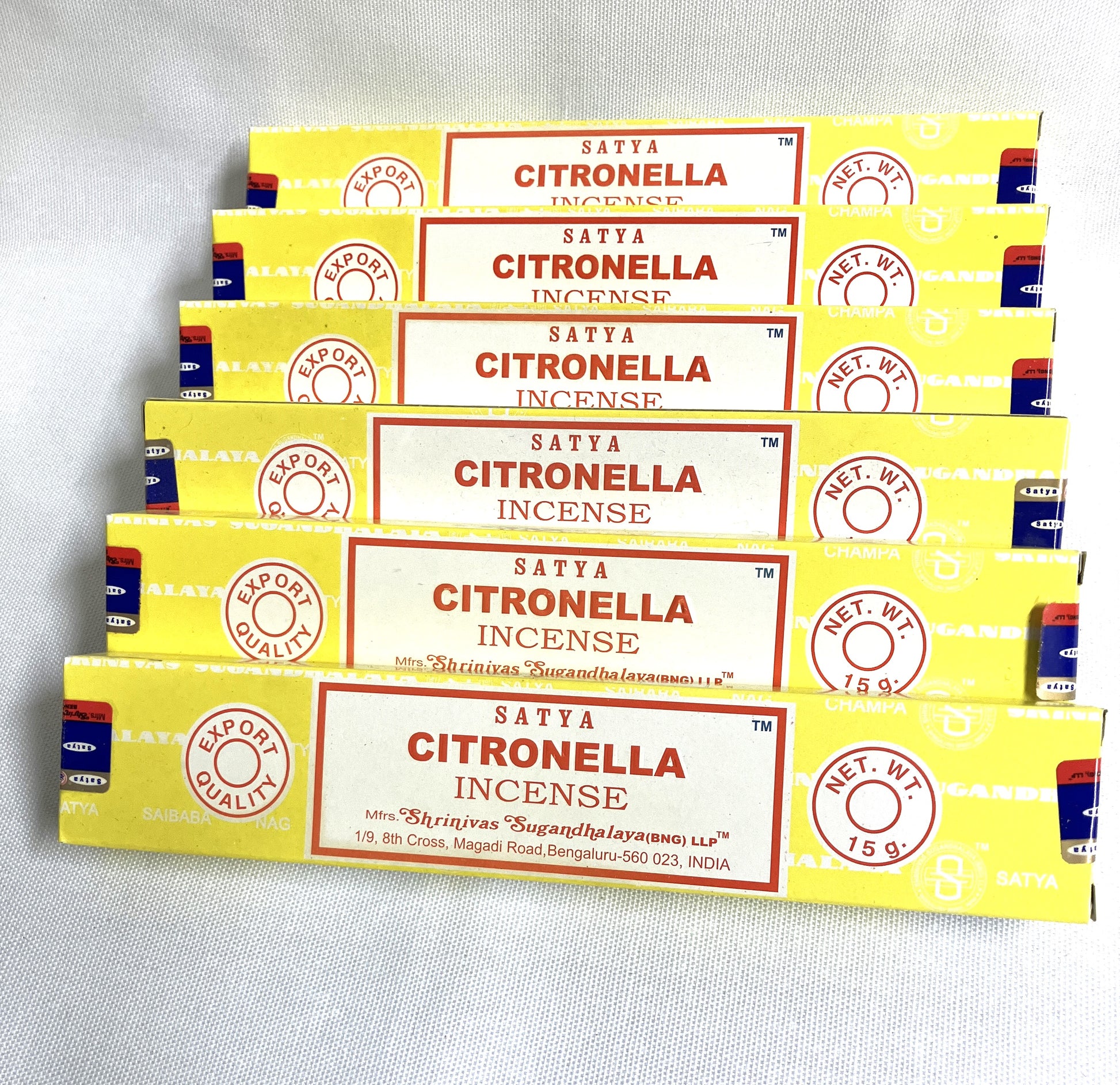 Multiple boxes of Satya Citronella Incense on a light gray background