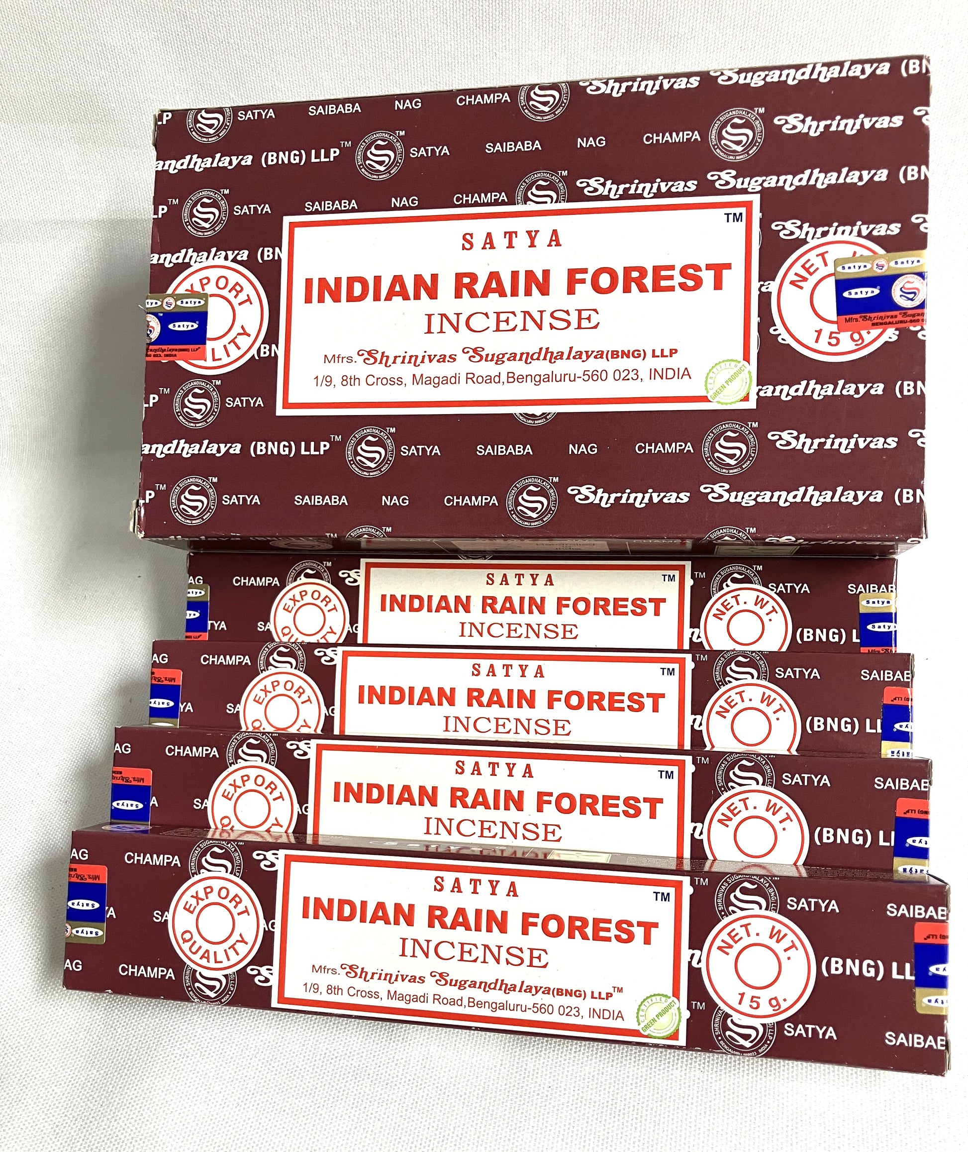 Stack of Satya Indian Rain Forest Incense boxes on a white background
