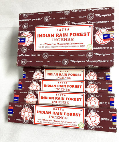 Stack of Satya Indian Rain Forest Incense boxes on a white background