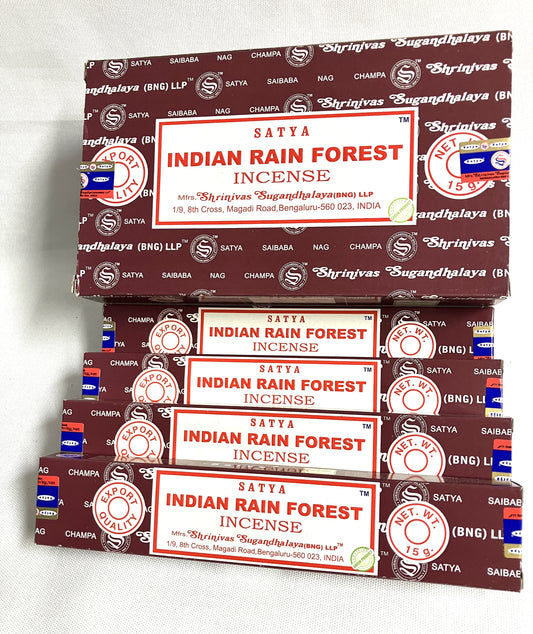 Stack of Satya Indian Rain Forest Incense boxes on a white background