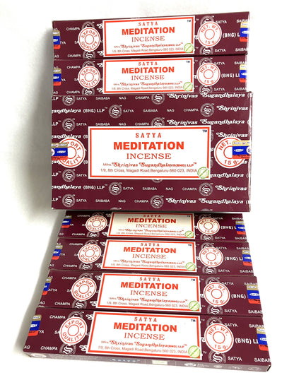 Multiple boxes of Satya Meditation Incense stacked on a white background