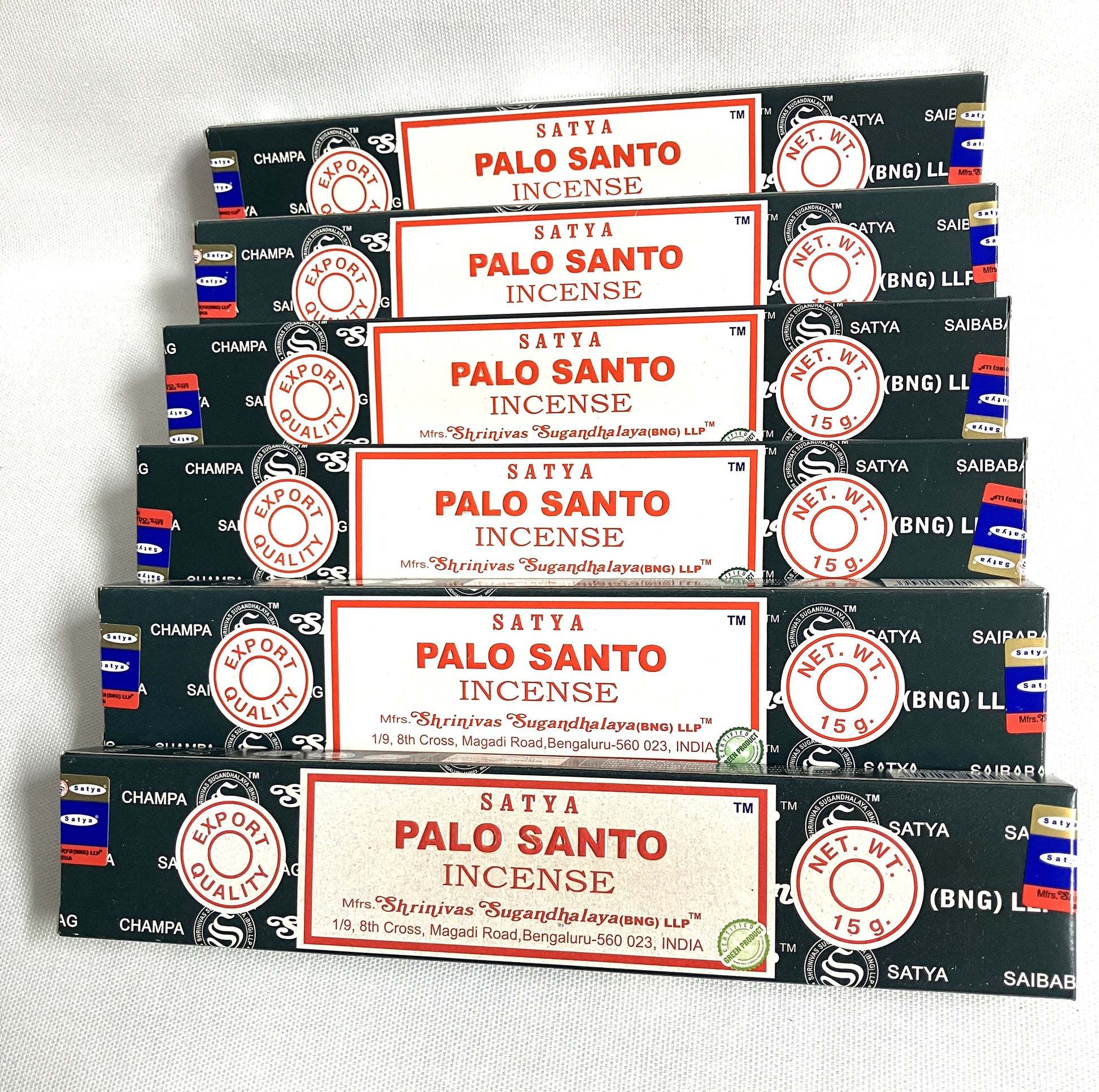 Multiple boxes of Satya Palo Santo Incense stacked on a white background