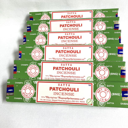 Multiple packages of Satya Patchouli Incense on a white background