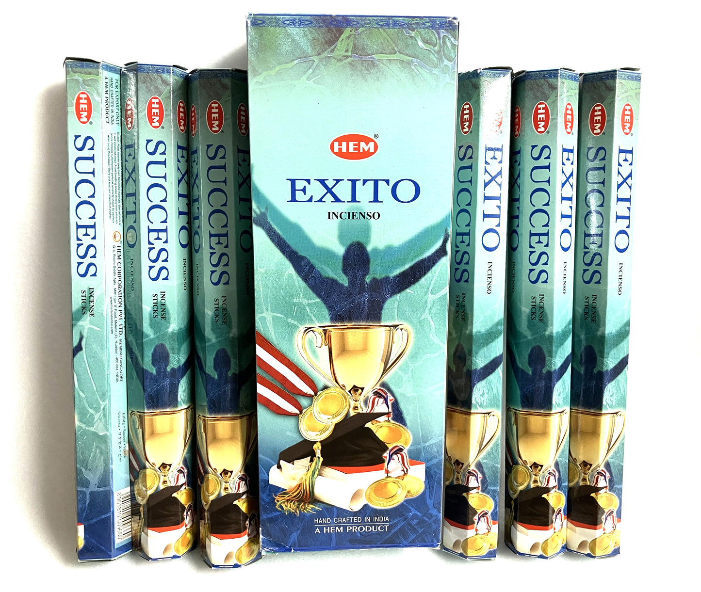 Hem Exito incense sticks packaging with a person holding a trophy on a white background. with the English title of Success also showing