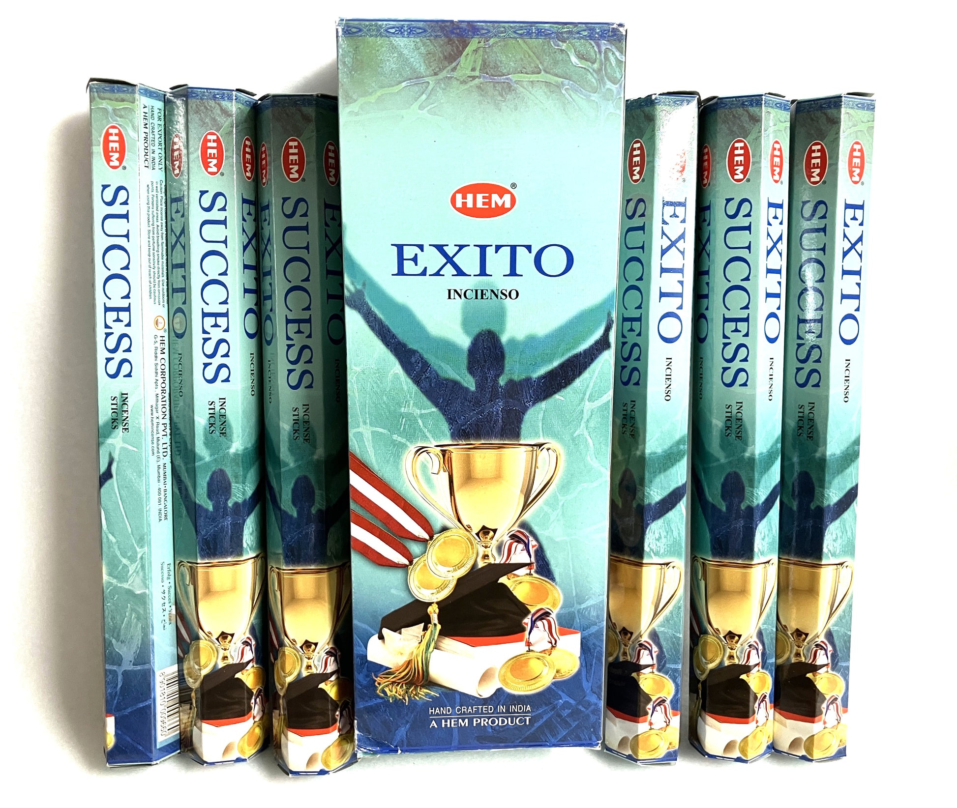 Hem Exito incense sticks packaging with a person holding a trophy on a white background. with the English title of Success also showing