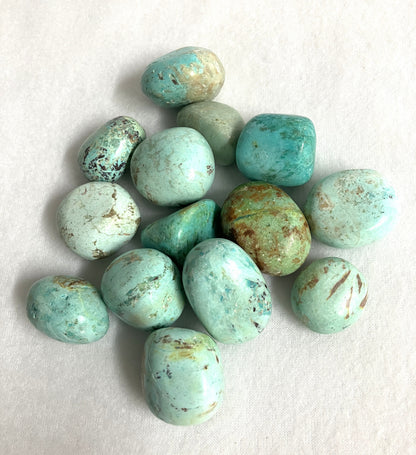 Turquoise Tumbled Crystals from Peru on a white background