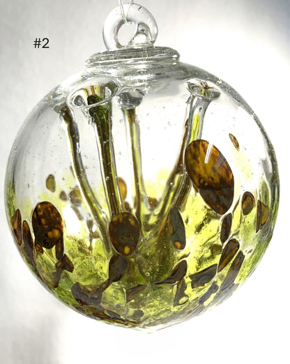 Blown Glass Witch Balls with abstract design on a white background