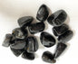 Collection of Astrophyllite Crystals on a white fabric background