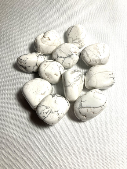Howlite Crystals  showing the veining on a gray background