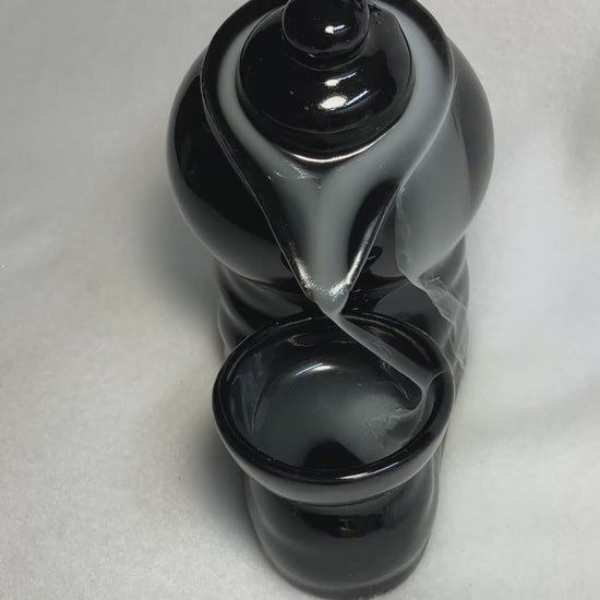 Backflow Tea Pot incense burner shown with cascading smoke. 