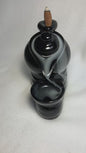 Backflow Tea Pot incense burner shown with cascading smoke. 