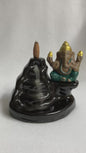 Ganesh Backflow Burner shown with a burning cone and smoke cascading down the front