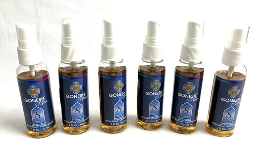 Grouping of Ganesh Air Room Freshener Spray with blue labels on a white background